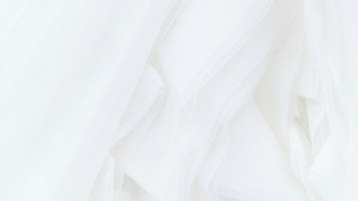 Soft white fabric draped in folds