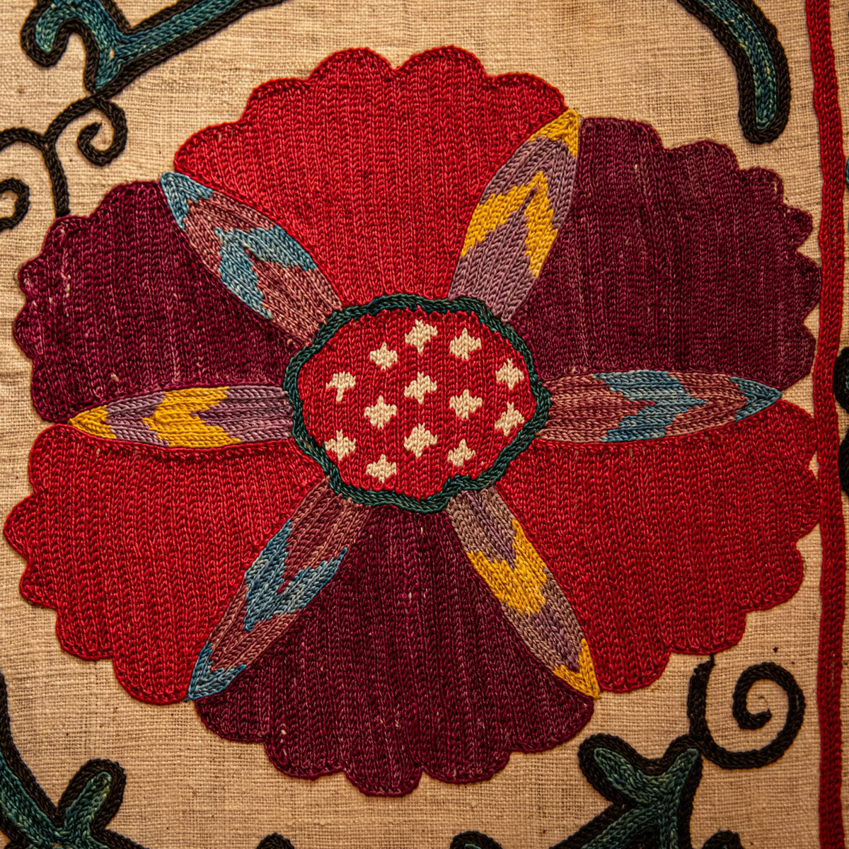 Maroon peach wool fabric in Crimson Medallion embroidered – close-up